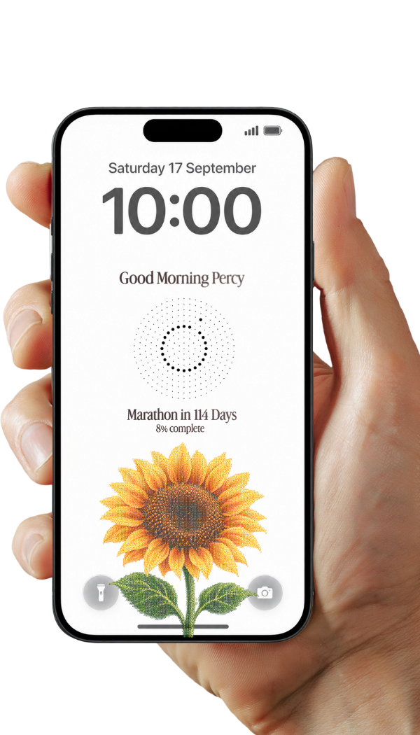 A hand holding an iPhone with a personalized sunflower milestone lock screen